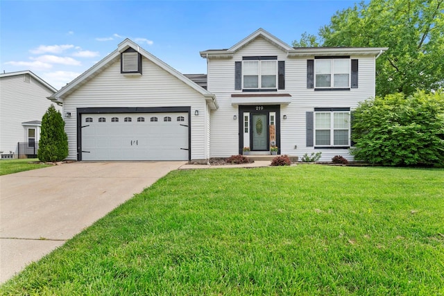 traditional-style home with driveway, a front yard, and a garage