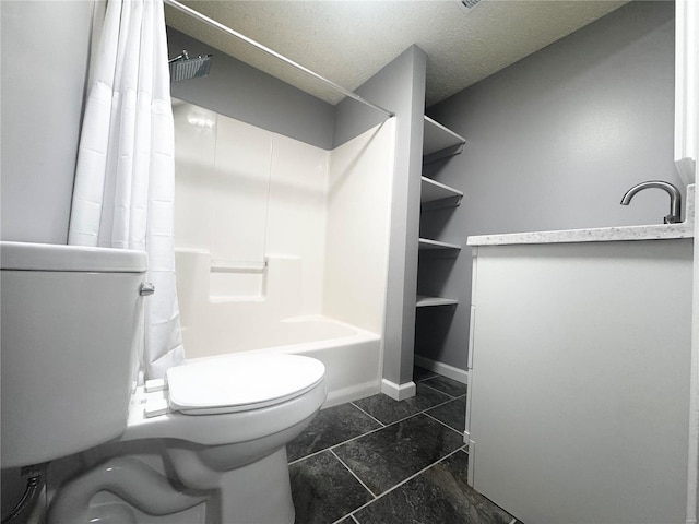 bathroom featuring toilet, baseboards, and a sink