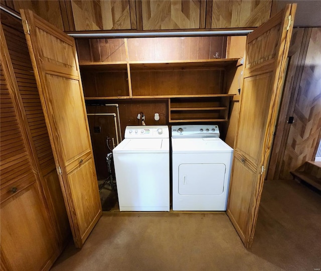 laundry area with light carpet, independent washer and dryer, and laundry area