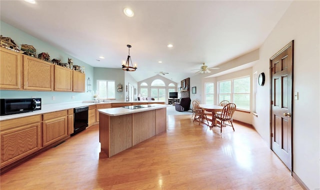 kitchen with light wood finished floors, ceiling fan, black appliances, and a wealth of natural light