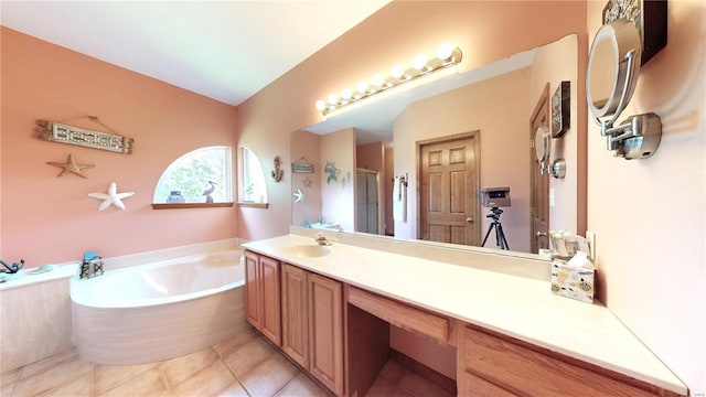 bathroom featuring vanity, tile patterned floors, a garden tub, and a stall shower