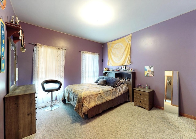 carpeted bedroom with baseboards