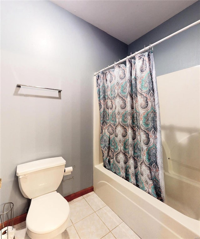 bathroom with toilet, baseboards, shower / bath combination with curtain, and tile patterned floors