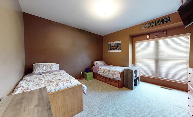 bedroom featuring carpet floors and visible vents