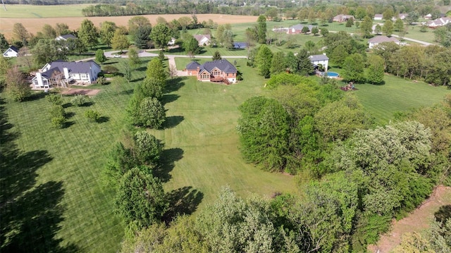 birds eye view of property with a rural view