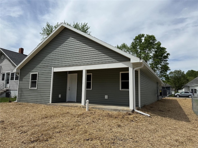 back of house featuring fence