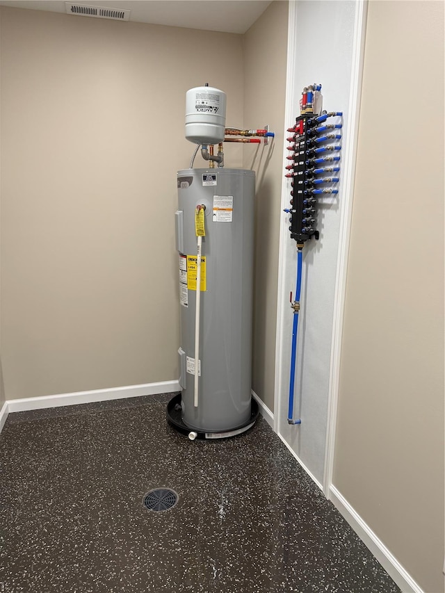 utilities featuring visible vents and electric water heater