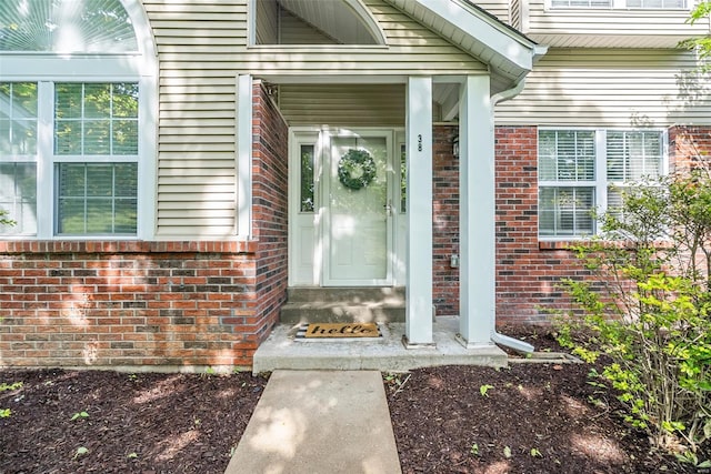 entrance to property with brick siding
