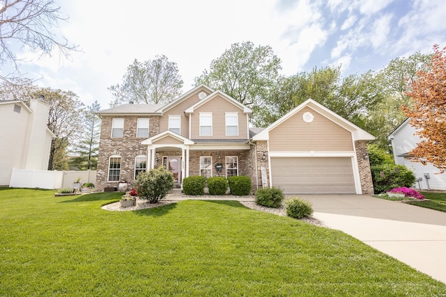 view of front of property with a garage, fence, a front yard, brick siding, and concrete driveway