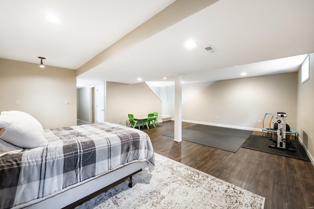bedroom featuring baseboards, recessed lighting, wood finished floors, and visible vents