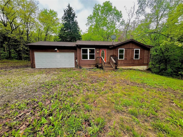 ranch-style home with a garage and board and batten siding