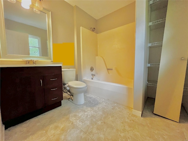 bathroom with vanity, tub / shower combination, and toilet