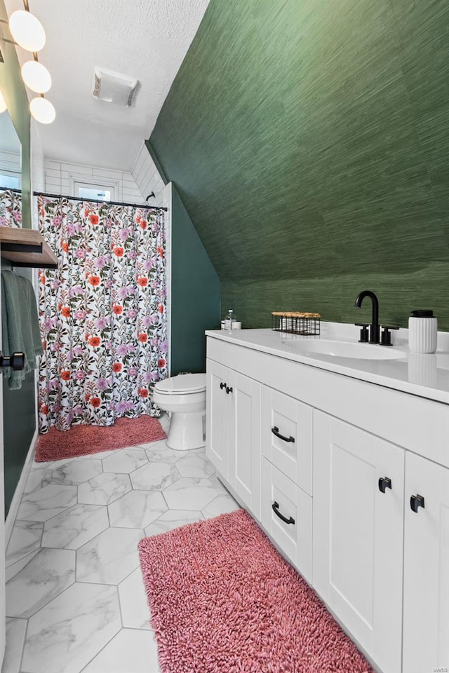 full bathroom featuring a shower with curtain, vanity, toilet, and marble finish floor