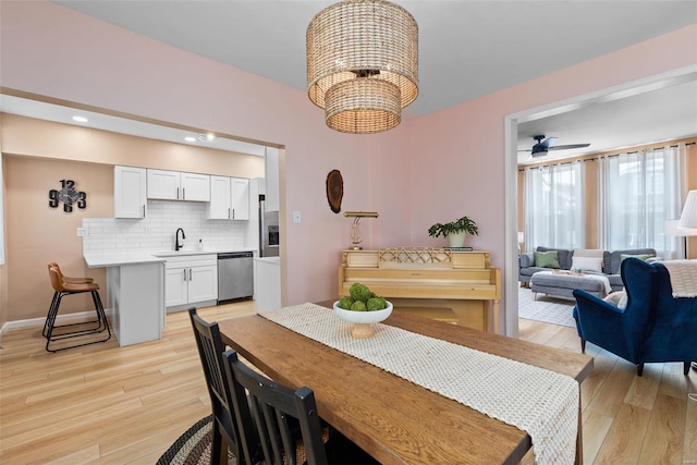 dining room with recessed lighting, baseboards, ceiling fan, and light wood-type flooring