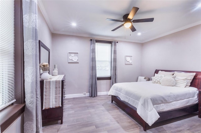 bedroom with crown molding, wood finished floors, baseboards, recessed lighting, and a ceiling fan