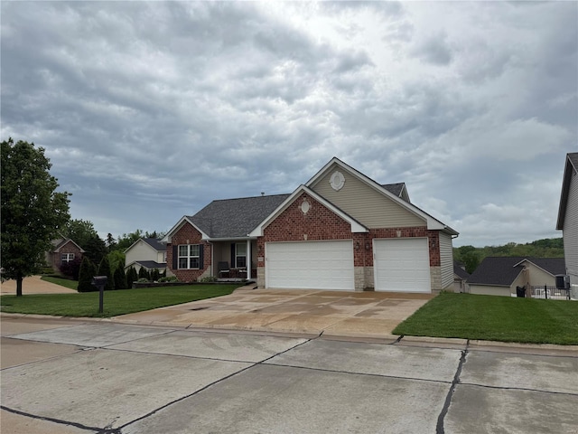 view of front of home with a garage, a front yard, driveway, and brick siding