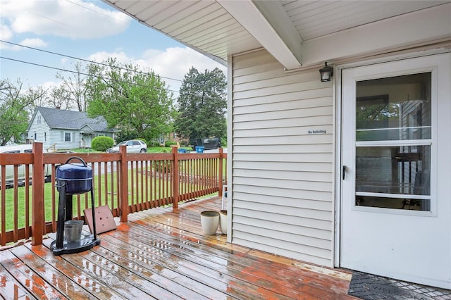 wooden deck with a yard