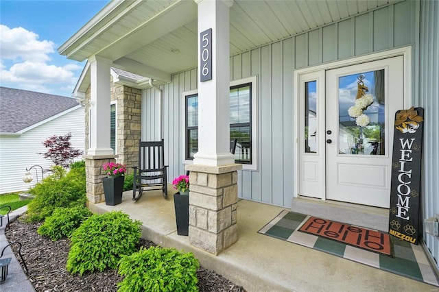 doorway to property featuring covered porch and board and batten siding