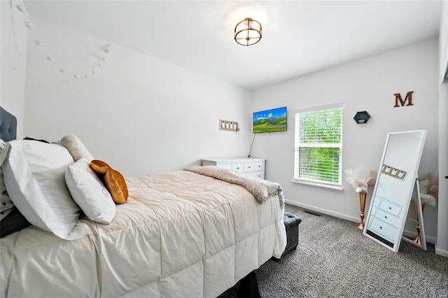 bedroom featuring baseboards and carpet flooring