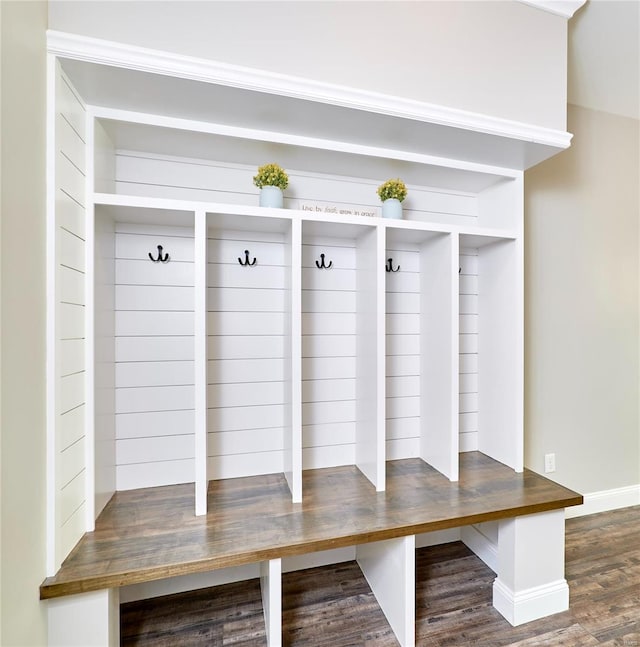 mudroom with baseboards and wood finished floors