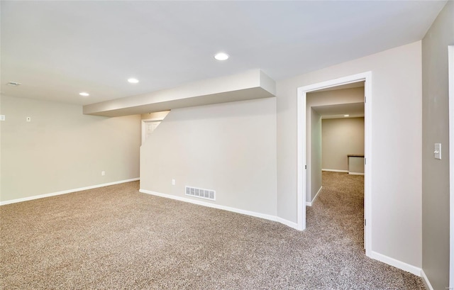 finished below grade area with carpet flooring, recessed lighting, baseboards, and visible vents