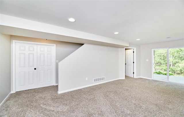 basement with visible vents, recessed lighting, baseboards, and carpet floors