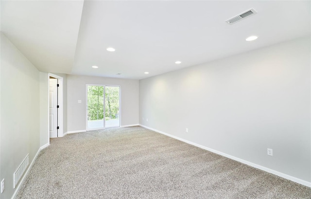 unfurnished room featuring carpet flooring, recessed lighting, and visible vents