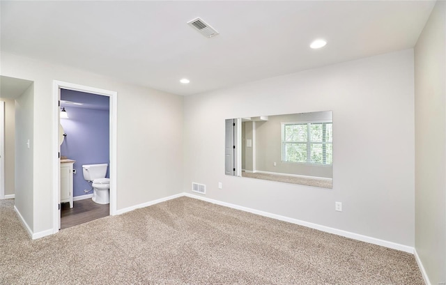 unfurnished bedroom with recessed lighting, baseboards, visible vents, and carpet