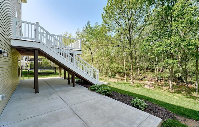 view of patio featuring stairs and a deck