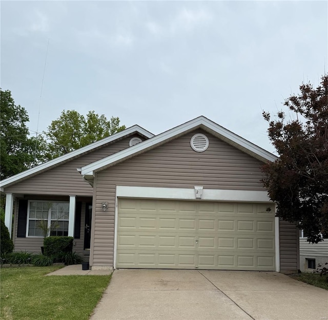 single story home featuring an attached garage and driveway