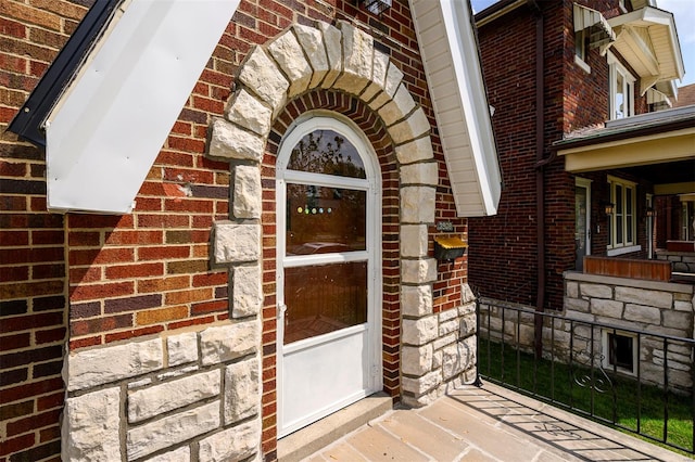 entrance to property with brick siding