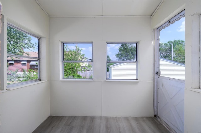 unfurnished sunroom featuring plenty of natural light