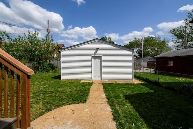 view of outdoor structure with fence and an outdoor structure
