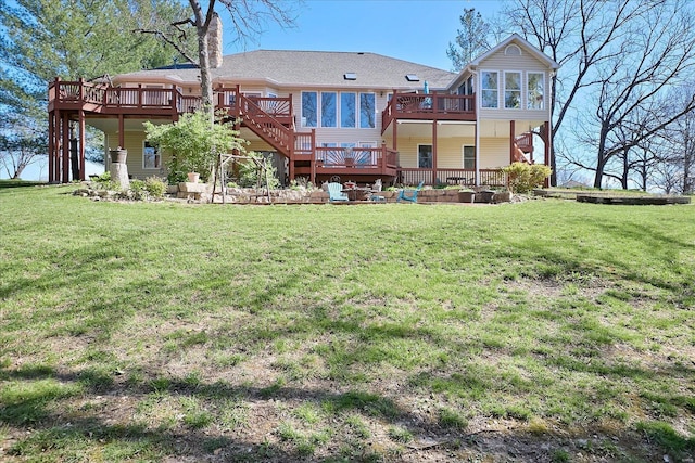back of house featuring a yard, a wooden deck, and a chimney