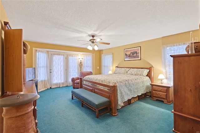 carpeted bedroom featuring a ceiling fan, a textured ceiling, and access to exterior