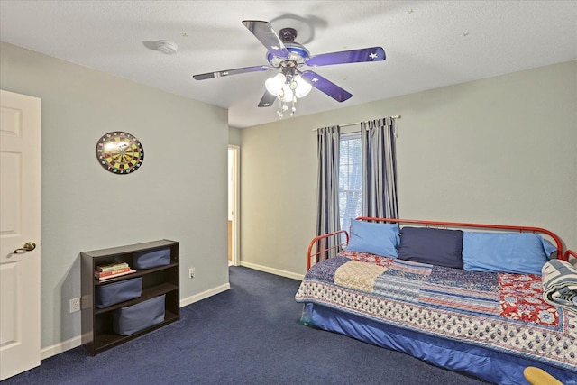 bedroom with carpet flooring, a ceiling fan, and baseboards