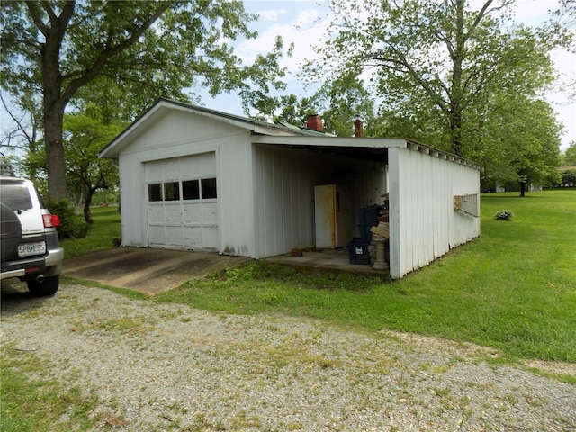 garage featuring a garage and driveway