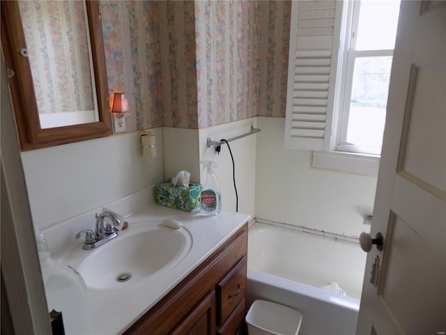 bathroom featuring vanity and a bathing tub