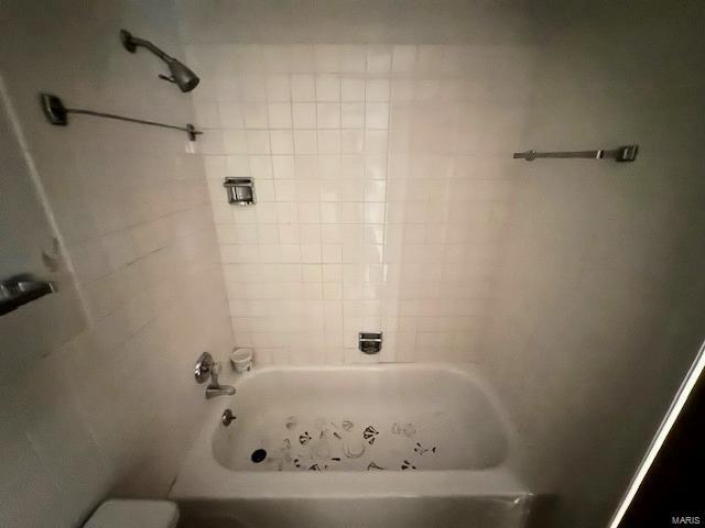 bathroom with toilet and shower / tub combination