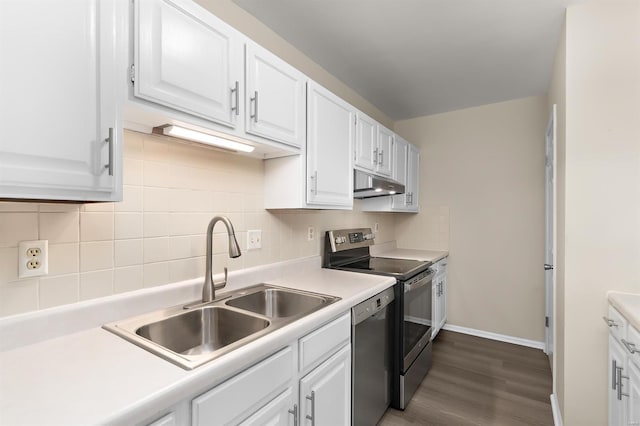 kitchen featuring a sink, stainless steel appliances, white cabinets, and under cabinet range hood