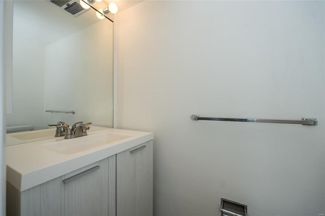 bathroom featuring vanity and visible vents