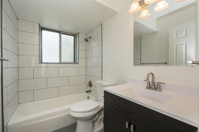 bathroom with vanity, toilet, and  shower combination
