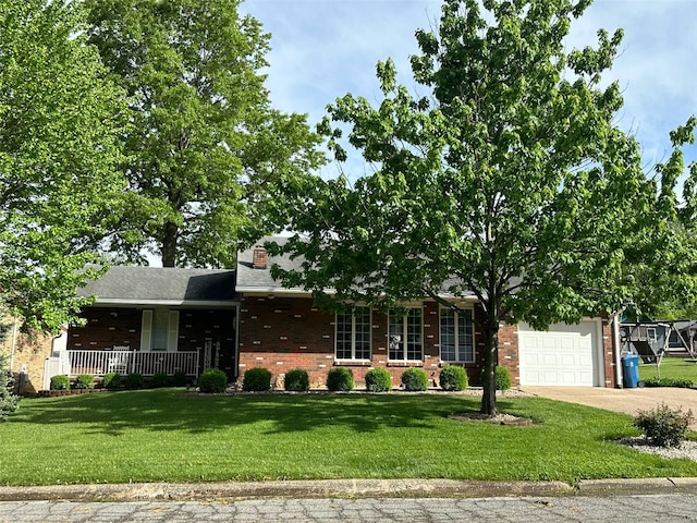 view of front of house with a front lawn, brick siding, a garage, a porch, and driveway