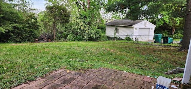 view of yard featuring fence and an outdoor structure