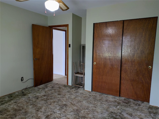 unfurnished bedroom featuring carpet floors and a closet