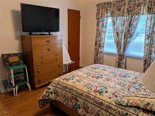 bedroom with wood finished floors