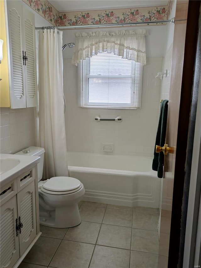 bathroom with vanity, shower / tub combo, tile patterned floors, and toilet