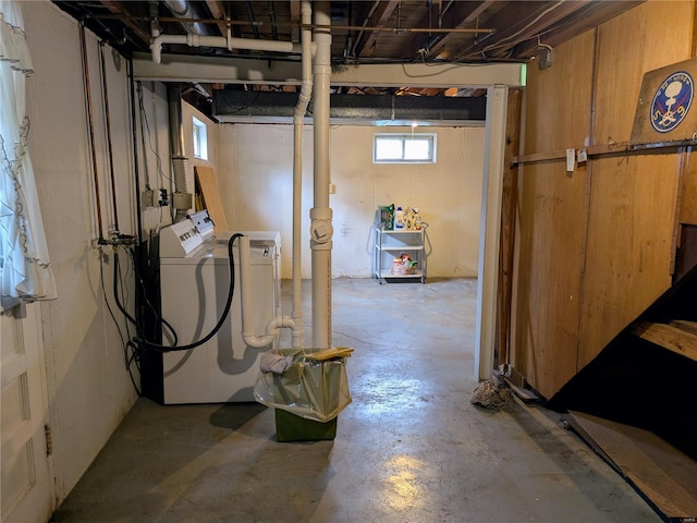 basement with washer and clothes dryer