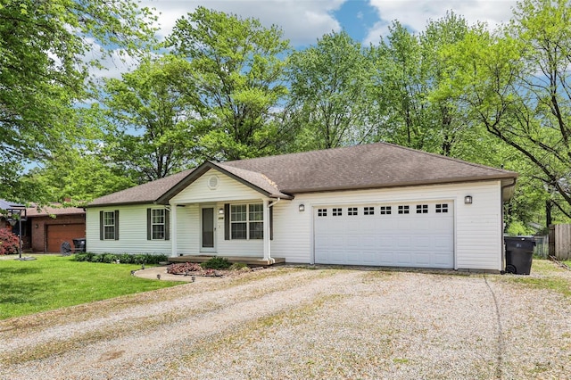 ranch-style house featuring covered porch, driveway, roof with shingles, a front yard, and a garage