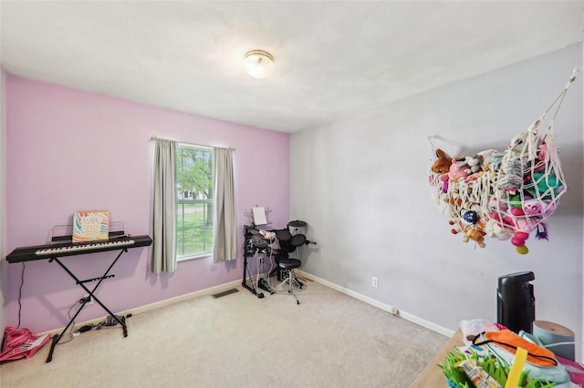 rec room with baseboards, carpet, and visible vents